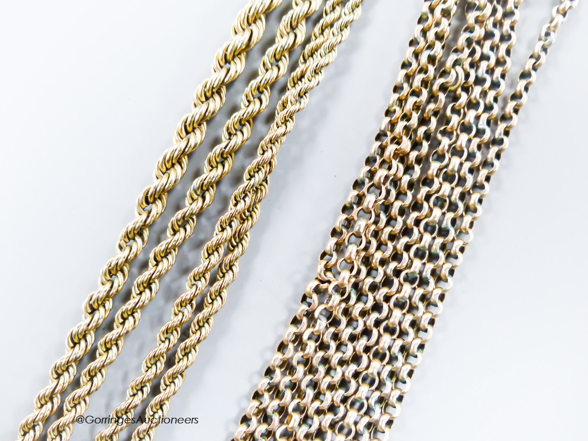 A yellow metal and rope twist chain, 46cm (a.f.) and an Edwardian yellow metal guard chain (a.f.), 106cm, gross 19.6 grams.